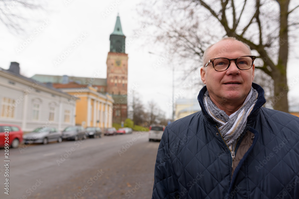 Mature handsome man enjoying life around the city of Turku, Finl