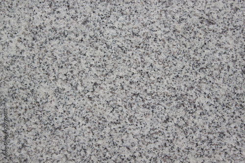 Gray grainy texture with marble chips. Used as a background.