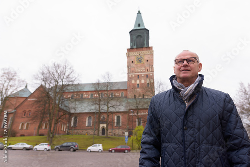 Mature handsome man enjoying life around the city of Turku, Finl