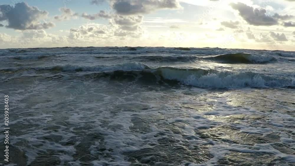 slow motion shot of storm wave during sunset in slow motion slow motion shot of storm wave during sunset in slow motion