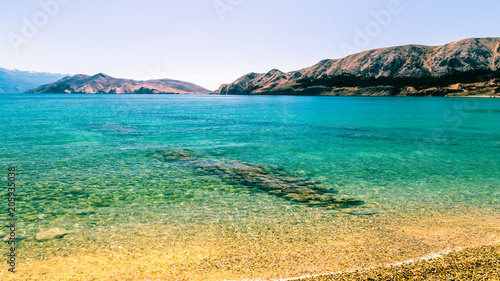 The beautiful beach of Baska in a sunny day, Krk Island, Dalmatia, Adriatic Coast, Croatia.