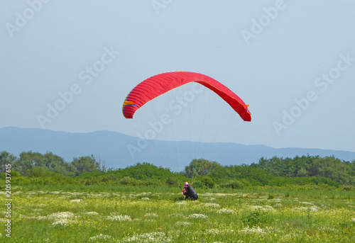 Paraglider landing in Rose Valley, Bulgaria