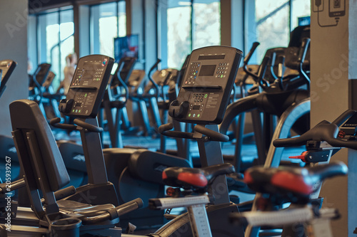 Interior of fitness hall with fitness bicycles.