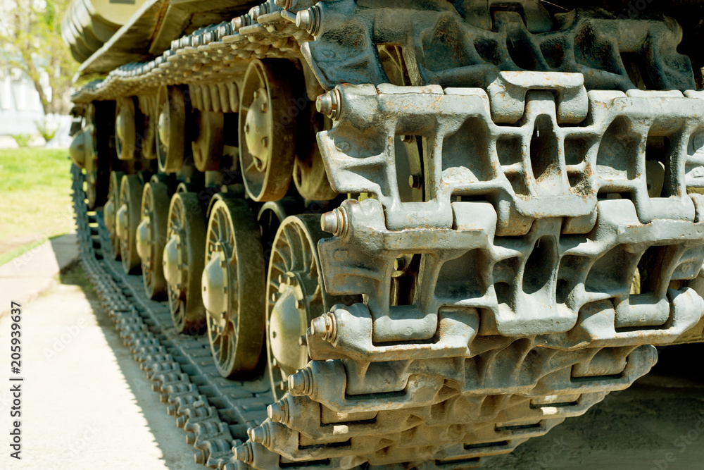 Caterpillar of military tank or excavator. Close-up photo