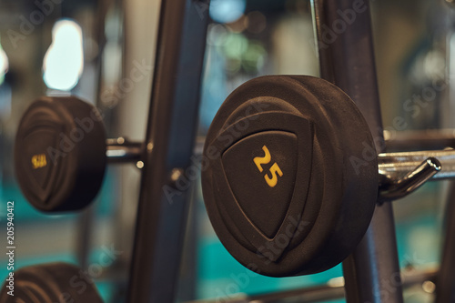 Closeup image of dumbells on a stand. Gym equipment