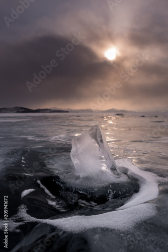 A piece of ice outside the flat ice of lake Baikal, Irkutsk region, Siberia, Russia photo