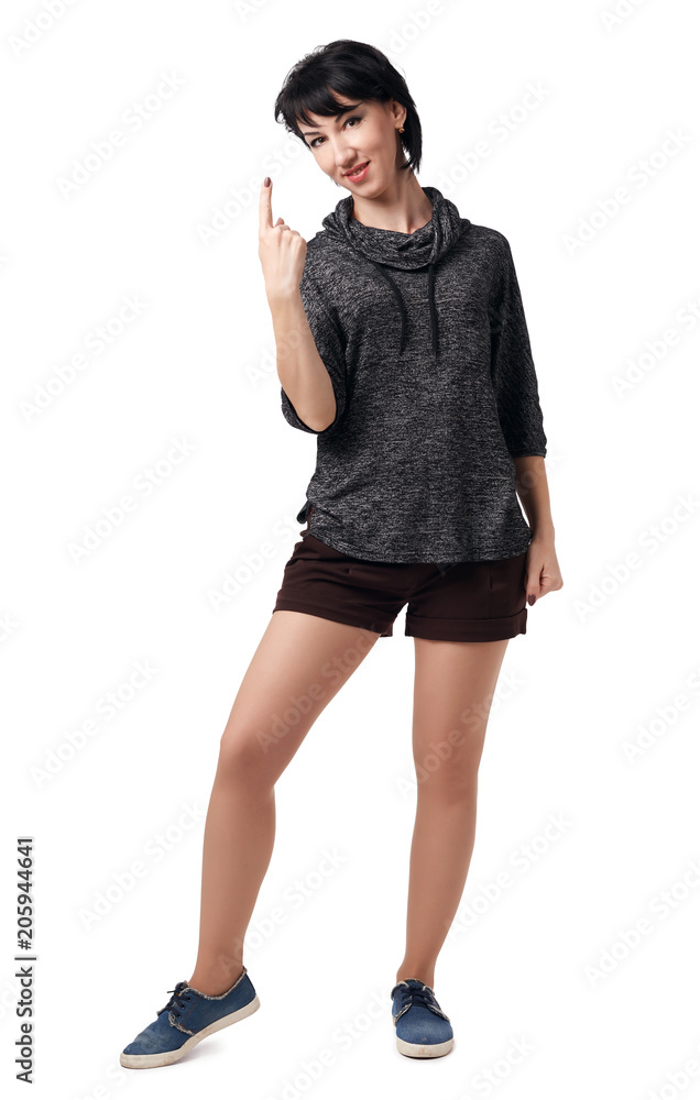 Fototapeta premium young woman posing in studio on white background, wearing brown shorts and shirt