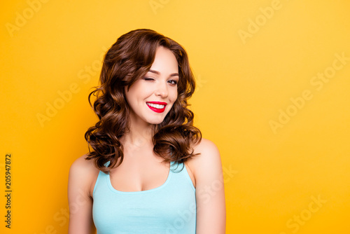 Fotografija Portrait with copyspace empty place of foxy funny girl with modern hairdo winkin