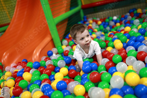 Boy playing in ball pool