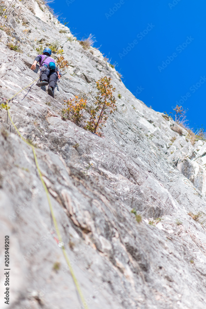 Rock climbing on vertical cliff
