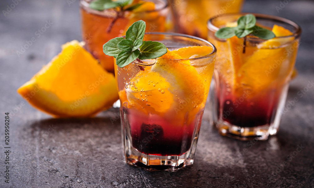 Summer drink with orange and berries Summer drink with orange and berries