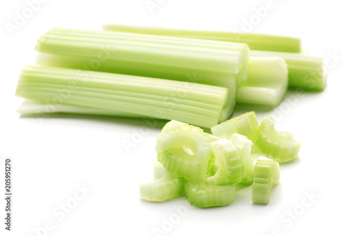 heap of celery green sticks isolated on white background