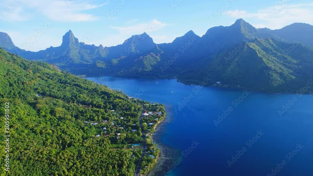 Aerial view of tropical paradise shore of Moorea island, lush green jungle, scenic hills and mountains around Opunohu Bay - South Pacific Ocean, French Polynesia landscape from above, 4k Aerial view of tropical paradise shore of Moorea island, lush green jungle, scenic hills and mountains around Opunohu Bay - South Pacific Ocean, French Polynesia landscape from above, 4k