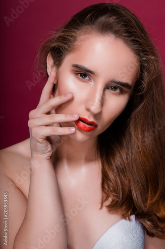 Beauty portrait of young lovely girl with clean skin and red lips