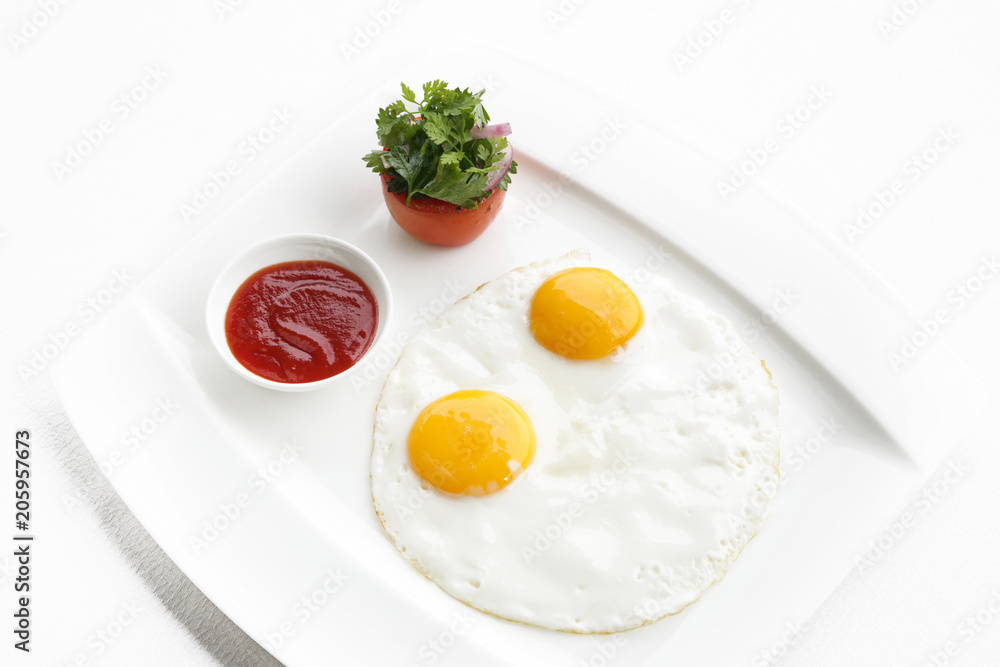 Sunny side up eggs served in the restoraunt for breakfast Sunny side up eggs served in the restoraunt for breakfast