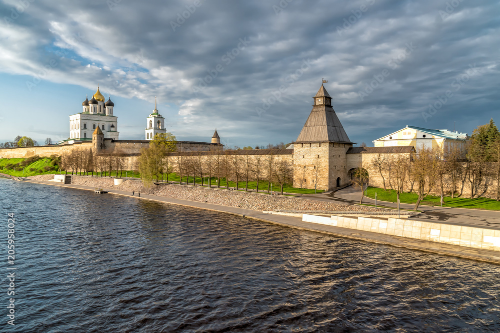 Fototapeta premium View of the Pskov Krom or Kremlin from the Velikaya River at sunset, Russia