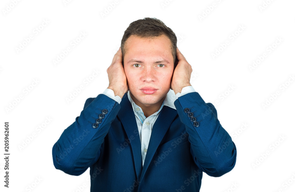 A young businessman covered his ears with his hands. I can not hear the concept A young businessman covered his ears with his hands. I can not hear the concept