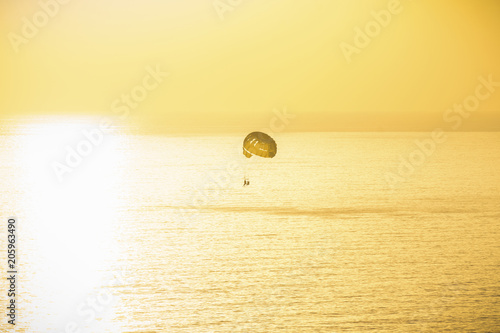 Background colorful sky concept: Dramatic sunset with a boat without clouds. Alanya, Turkey, the Mediterranean Sea