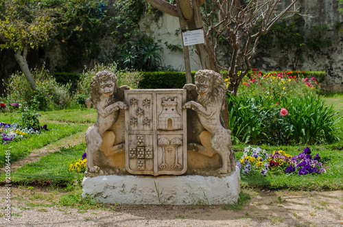 City symbol - statue in the park of the Tavira town in Portugal