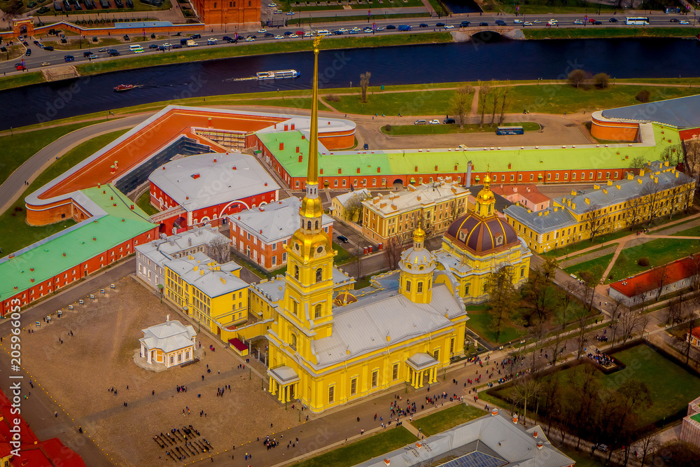 Beautiful above view of Peter and Paul Fortress, surrounding of different buildings in the city of Saint-Petersburg, during a gorgeous sunny day