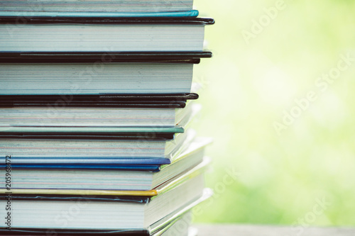 Books stack on the wooden chair for business  education back to school concept.