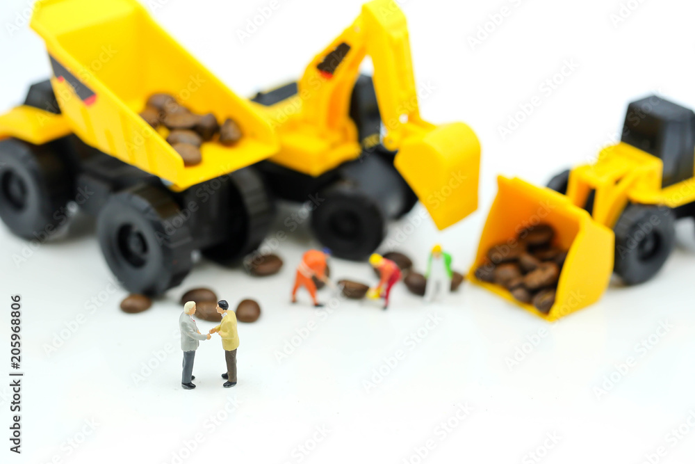 Miniature people : professional construction engineer with businessmans,industrial engineering business concept Miniature people : professional construction engineer with businessmans,industrial engineering business concept
