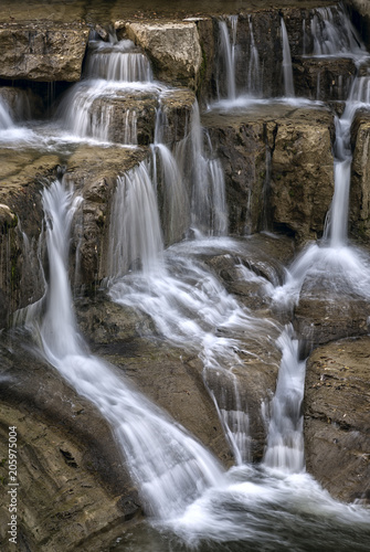 Waterfall flowing down several tiers of rock