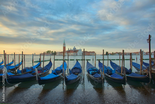 Gondolas in front of the San Giorgio Maggiore church in Venice at sunrise © Lori Labrecque