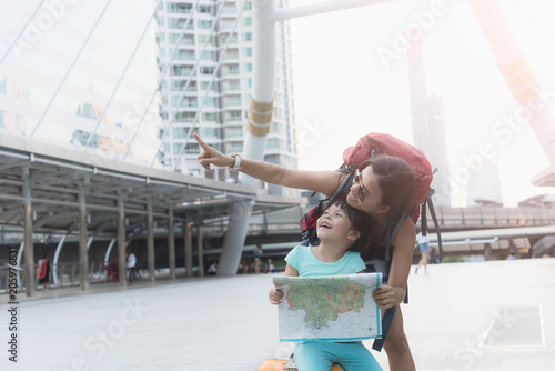 Canvas Print woman and girl in summer city. Travel and vacations concept