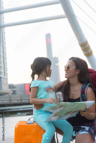 woman and girl in summer city. Travel and vacations concept photo