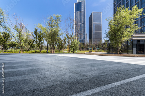 Panoramic skyline and modern business office buildings with empty road,empty concrete square floor