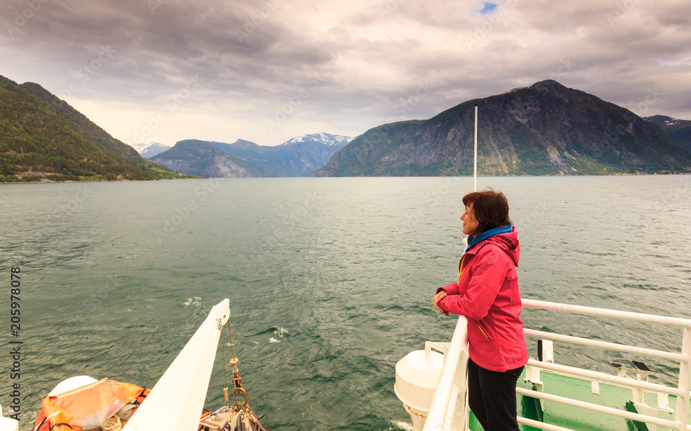 Tourist woman on liner in Norway