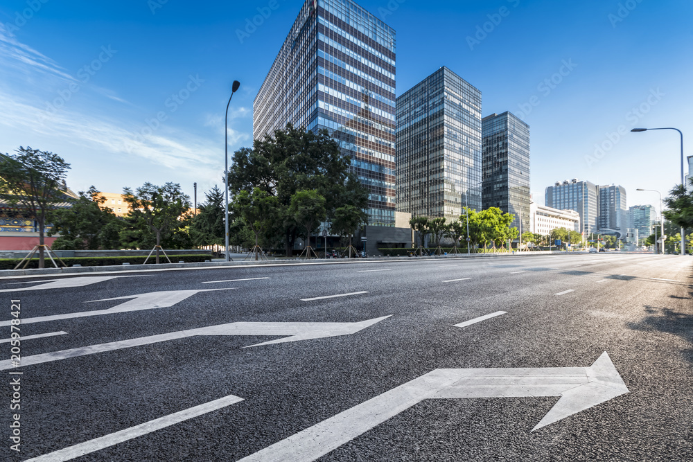 Panoramic skyline and modern business office buildings with empty road,empty concrete square floor Panoramic skyline and modern business office buildings with empty road,empty concrete square floor