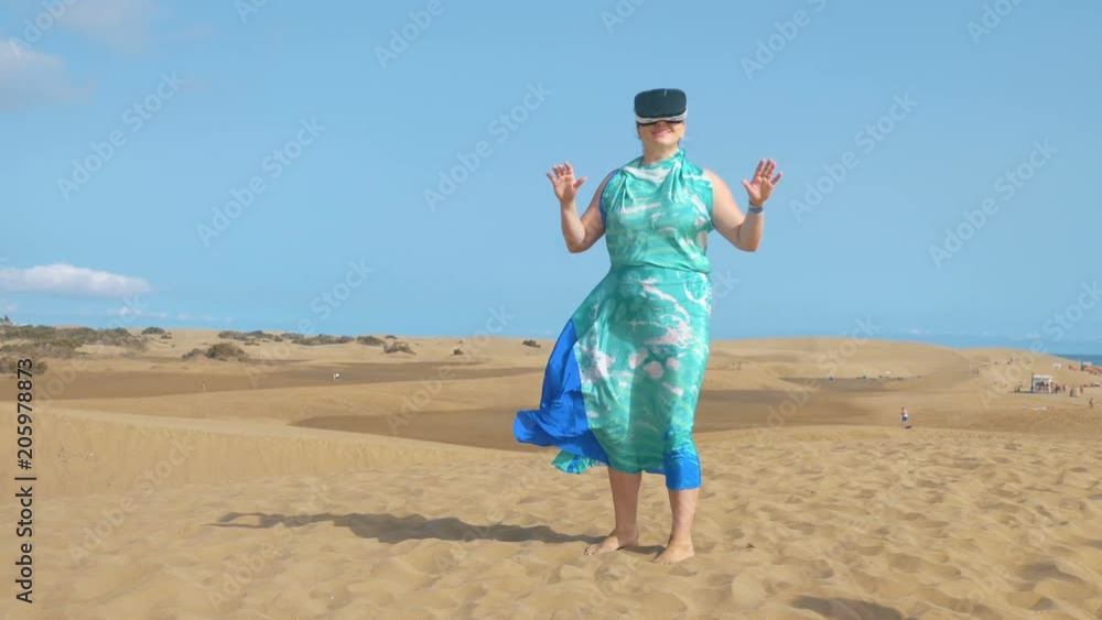 Professional video of woman wearing virtual googles on desert in 4k slow motion 60fps Professional video of woman wearing virtual googles on desert in 4k slow motion 60fps