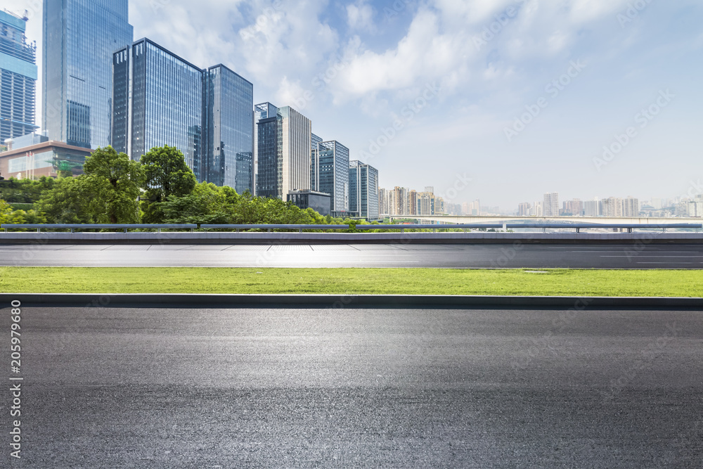 Fototapeta premium Panoramic skyline and modern business office buildings with empty road,empty concrete square floor