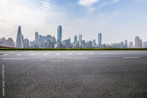 Panoramic skyline and buildings with empty road