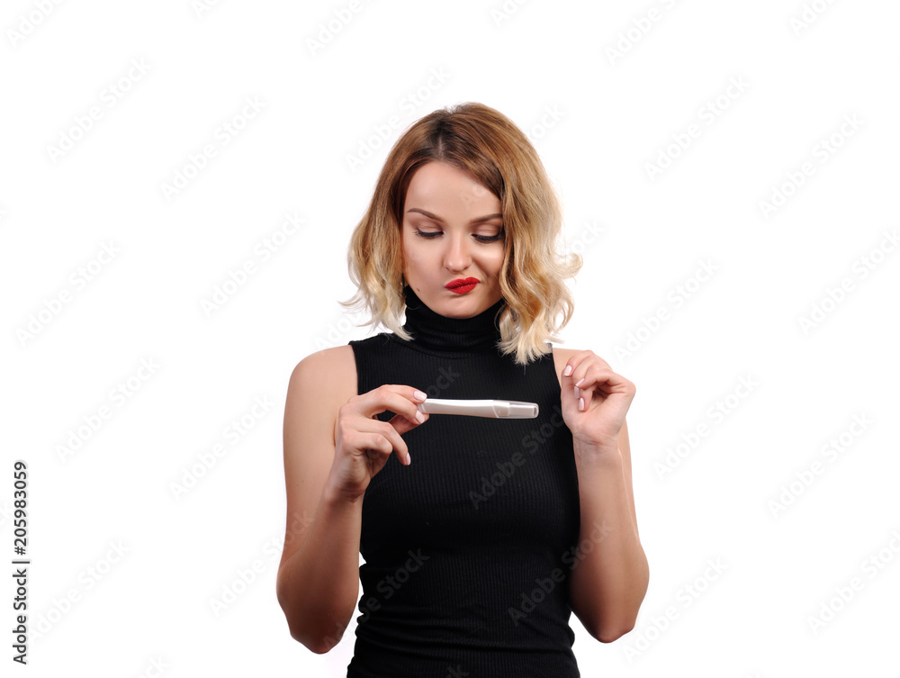 Shocked upset woman looking at pregnancy test Shocked upset woman looking at pregnancy test
