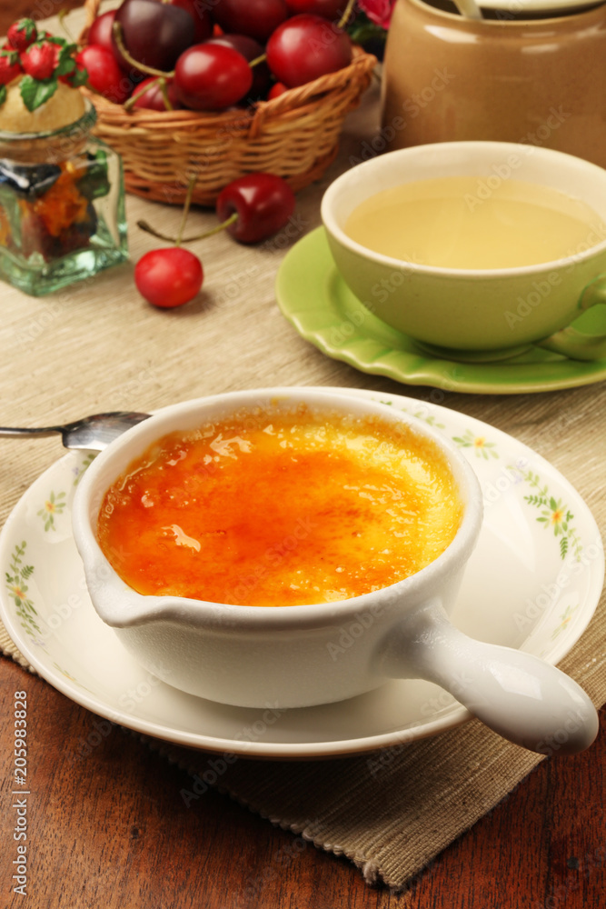 Delicious french dessert creme brulee on the table Delicious french dessert creme brulee on the table