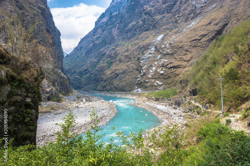 Fototapeta Naklejka Na Ścianę i Meble -  Mountain river in a deep gorge in the Himalayas.