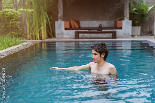 man playing in swimming pool © geargodz