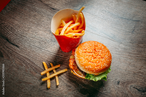 Big Mac hamburger and a salad. The concept of diet and fast food
