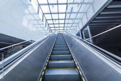 Close up to escalator yellow and gray steel line © MyCreative