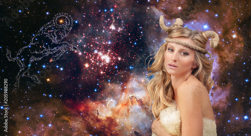 Astrology. Aries Zodiac Sign. Woman on night sky background