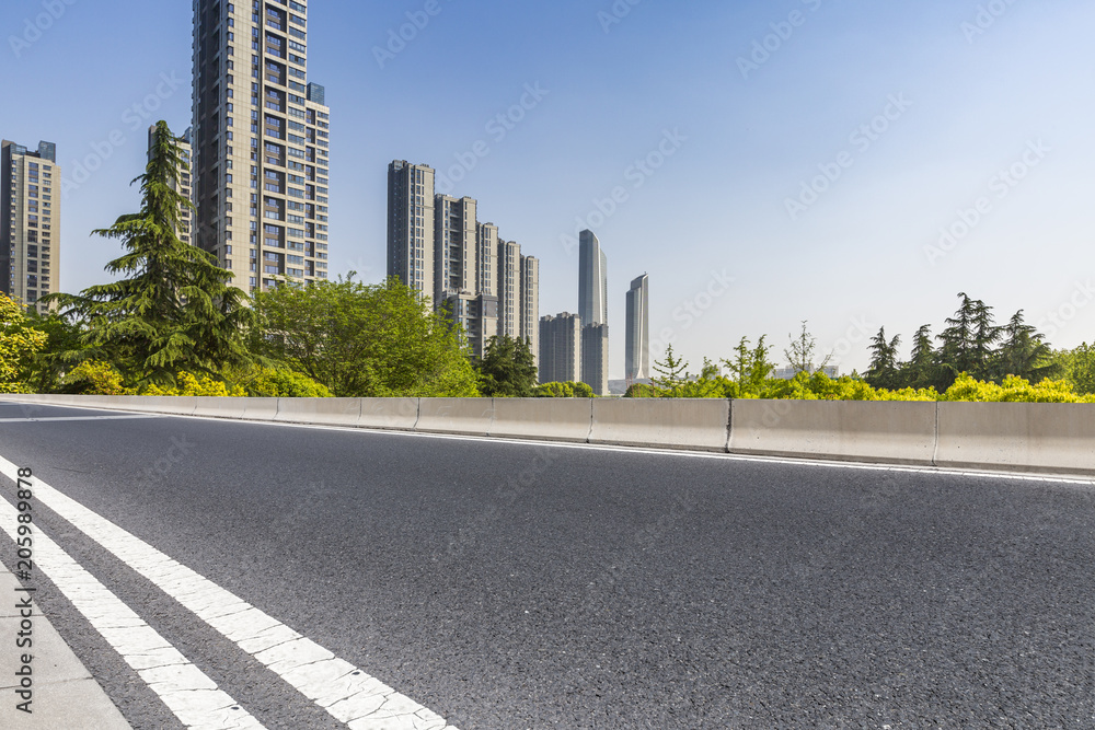 Modern business office buildings with empty road,empty concrete square floor Modern business office buildings with empty road,empty concrete square floor