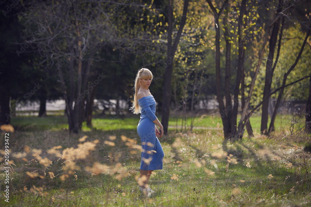 beautiful young blond woman walk in the park beautiful young blond woman walk in the park
