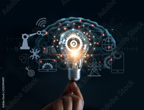 Hand holding light bulb and cog inside and innovation icon network connection on brain background, innovative technology in science and industrial concept
