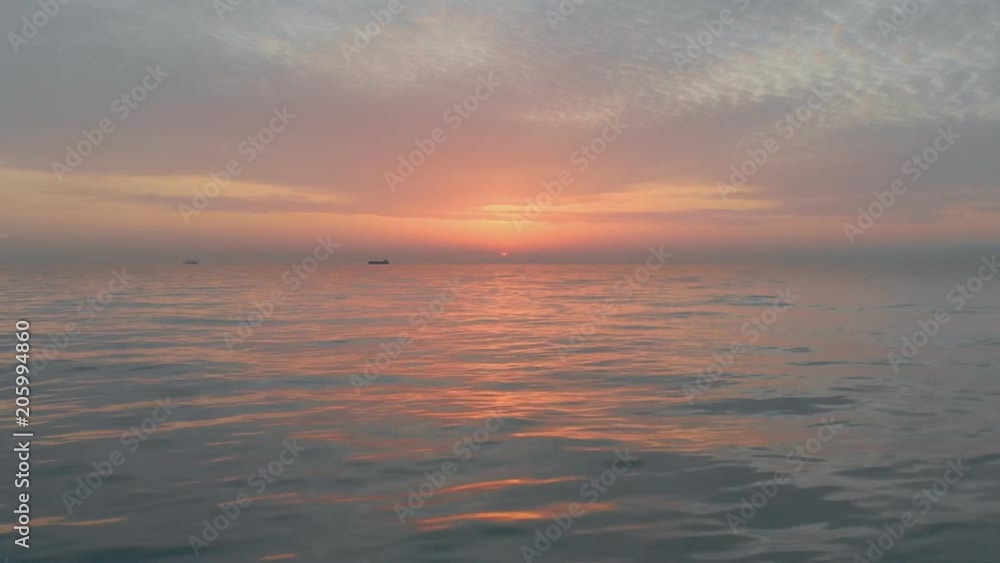 Low flight over the sea surface. Beautiful reflection on waves water. Aerial 4k video. Seascape nature footage. Low flight over the sea surface. Beautiful reflection on waves water. Aerial 4k video. Seascape nature footage.
