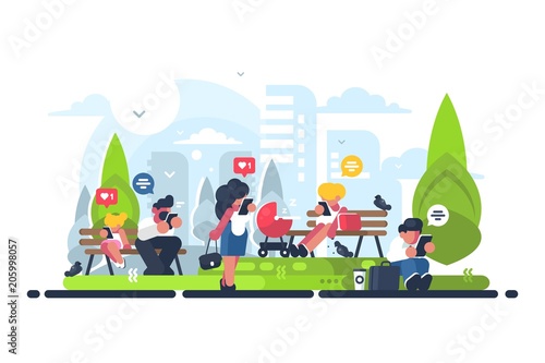 People in green park using gadget