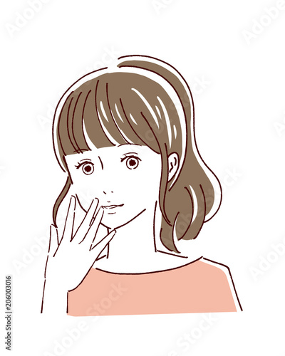 顔に手をあてる女性