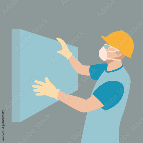 the worker fixes the foam board on the wall